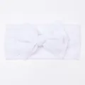Detail view of the soft white mesh fabric and oversized bow on the infant headband - White