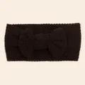 Detail of dark coffee waffle knit baby headband featuring a large soft textured bow - Black