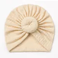 Cream knit baby turban hat featuring jacquard weave and a cute donut twist knot design - Beige
