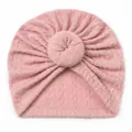 Detailed knit texture of pink baby turban hat with a stylish soft donut knot design - Flesh Pink
