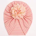 Detail of baby turban hat with pink stripes and large floral ornament with gold dots - Flesh Pink