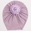 Detail of purple ribbed knit baby turban with a large handmade satin rose flower decor - Purple
