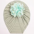 Detail of baby striped turban hat with a large mint green flower and gold foil dots - Light Green