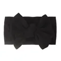 Detail of soft black nylon baby headband with a large bow showing ribbed elastic texture - Black