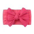 Detail of rose red nylon baby headband featuring soft ribbed knit fabric and large bow - Rose Red