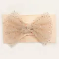 Close-up of soft nylon baby headband with a sequined mesh bow in peach color - Flesh Pink