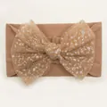 Detailed view of baby nylon headband featuring a large mesh bow with silver sequins - Coffee