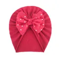 Close-up of rose red baby turban featuring a large gold polka dot chiffon bow detail - Rose Red