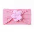 Close-up of pink baby headband with detailed twist knit texture and a soft fabric flower - Pink
