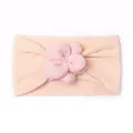 Detail of baby nylon headband featuring cable knit texture and 3D floral decoration - Nude Pink