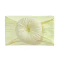 Detail of light yellow nylon baby headband with large jacquard donut flower knot - Beige