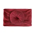 Close-up of wine red ribbed nylon headband with a soft donut knot for infants - Burgundy
