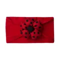 Detail of red baby headband with 3D polka dot flower made of soft elastic cotton fabric - Red