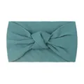 Detailed close-up of wide knotted nylon baby headband in teal green knit fabric - Navy Blue