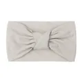 Detailed close-up of soft beige knot-style nylon headband with elastic matte texture fabric - Gray