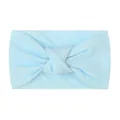 Detail of light blue soft nylon baby headband with a classic wide knot design - Blue