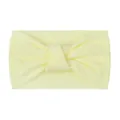 Detail shot of soft cream yellow knotted nylon headband with ribbed texture for babies - Beige