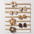 Set of 7 baby nylon headbands with cute bows and floral designs in warm earth tones - Mixed Colors And Styles