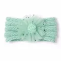 Detail eines mintgrünen Baby-Strandstirnbands mit flauschiger Netzblume und Sternen - Minzgrün