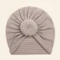 Detail of soft purple waffle knit texture and circular floral knot on baby turban hat - Gray