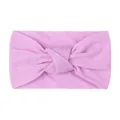 Detail of pink knotted baby headband made of soft elastic fabric for newborns - Purple