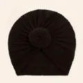 Detail view of baby waffle knit turban hat with central donut knot in dark coffee color - Black