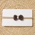Detail of dark brown bow headband with white stitching on soft elastic band - Dark Brown Stitched Bow