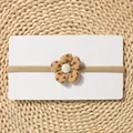 Close-up of khaki elastic baby headband with floral fabric flower and pearl accent - Khaki Floral Petal Flower