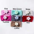 Detail view of colorful knitted baby headbands with 3D fabric flower and pearl accents - Mixed 7 Colors