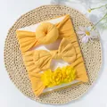 Lot de trois bandeaux jaunes pour bébé avec nœud et fleurs sur un tricot côtelé - Lot de 3 / Jaune