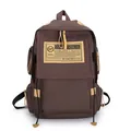 Brown canvas laptop backpack with vintage workwear style and yellow logo patch - Coffee