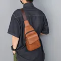 Brown leather sling bag for men with adjustable shoulder strap and pebbled texture - Orange (5803)