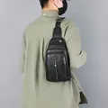 Classic black leather crossbody chest bag with adjustable strap and silver metal hardware - Black (5805)