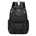 Men's large business backpack in black waterproof fabric with vibrant orange zipper details - Black