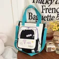 Detail of color-block canvas tote bag with Happy Days patch and mesh pocket - Black