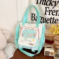 Detalle del bolso tote de lona con bordados y bolsillos con cremallera verde menta - Verde