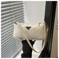 Chic cream nylon underarm dumpling bag with metal triangle plaque and slim shoulder strap - White
