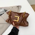 Brown soft leather pleated cloud bag with large gold buckle and chunky chain strap - Brown
