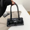 Retro black leather baguette shoulder bag with silver hardware and rivet details - Black