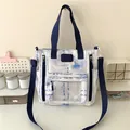 Detalle del bolso tote de lona con estampado de caligrafía china y bolsillo transparente - Azul