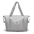 Lightweight grey expandable travel bag with double handles and waterproof compartment - Gray