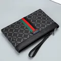 Classic black men's clutch bag with monogram pattern and signature striped ribbon strap - Black