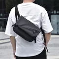 Minimalist black waterproof crossbody messenger bag with adjustable wide nylon strap - Black