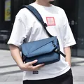 Dark blue waterproof nylon messenger bag with flap closure and adjustable strap - Blue