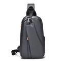 Men's matte black crossbody chest bag with vibrant orange zipper pull accents - Gray