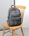 Fashion camouflage backpack in grey and black with vibrant orange zipper pull accents - Gray
