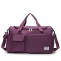Detailed view of purple nylon travel bag featuring multiple pockets and detachable strap - Deep purple