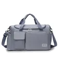 Detail of blue nylon travel bag with dual front pockets and adjustable shoulder strap - Blue
