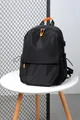 Schwarzer Laptop-Rucksack mit orangefarbenen Akzenten und USB-Anschluss für Pendler - Schwarz