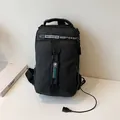 Black sports chest bag with external USB charging port and durable nylon finish - Black